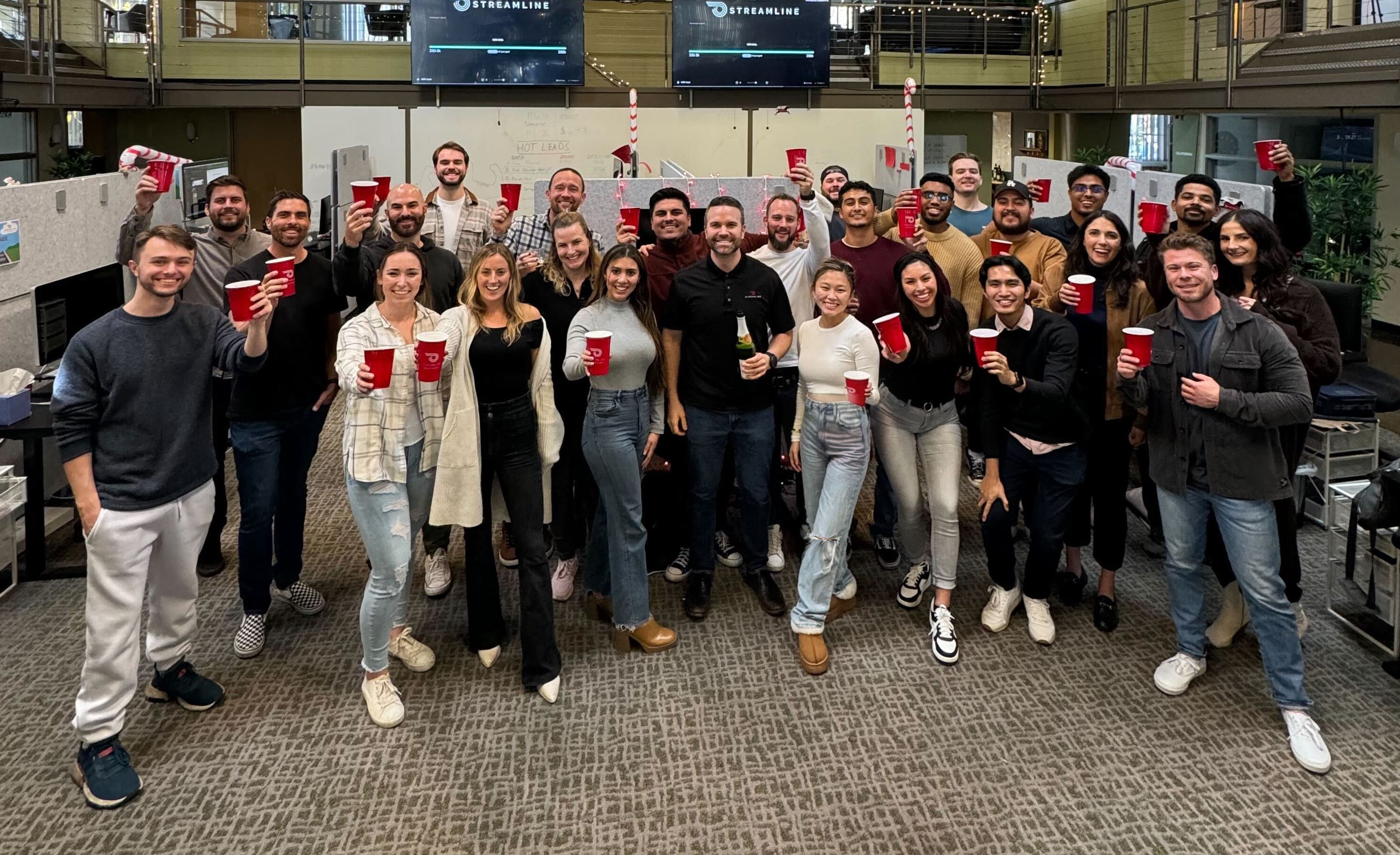 Streamline team posing with solo cups