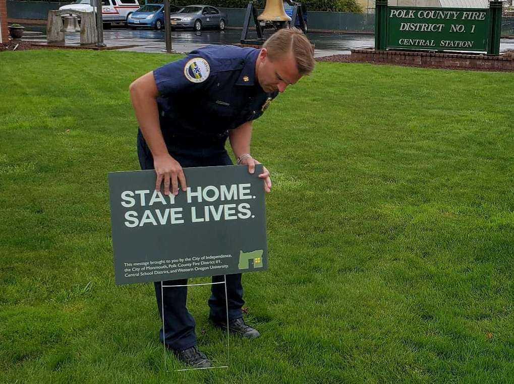 Chief Stange installs yard sign